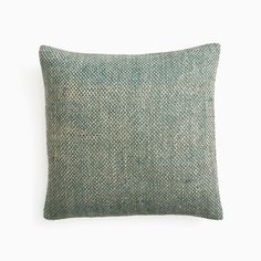 a green pillow on a white background