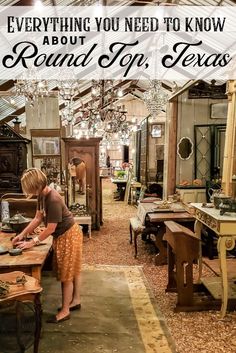 a woman is standing in an old fashioned shop