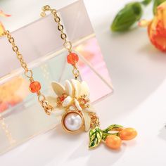 Orange Blossom Necklace is great enamel jewelry with a 18k gold chain which is sturdy enough. You can find this flower necklace on Selenichast online shop. It can be shipped to many countries. Finally complete your cottagecore look with our exquisite Orange Necklace. Crafted of brass enamel, this masterpiece will add a burst of vibrant color to your ensemble and make the perfect gift for a special someone. Let the unique beauty and elegance of its design enliven your wardrobe. Orange Blossom Nec Elegant Enamel Jewelry With Delicate Chain, Enamel Necklaces With Flower Charm And Pendant, Enamel Flower Pendant Necklace With Charm, Enamel Flower Pendant Necklace With Flower Charm, Flower-shaped Enamel Necklaces For Gifts, Gold Enamel Flower Pendant Necklace, Gold Flower-shaped Enamel Jewelry, Gold Enamel Flower Jewelry, Elegant Yellow Flower Necklace For Gift