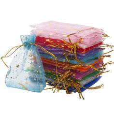 five bags filled with different colored items on top of each other and tied to string