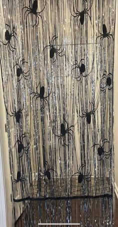 a curtain with black spider webs on it