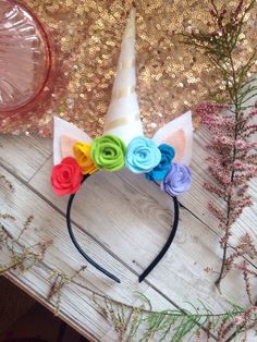 a unicorn headband with flowers on it