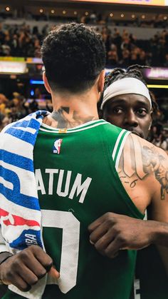 NBA basketball wallpaper background of Boston Celtics stars Jrue Holiday and Jason Tatum hugging after a victory Finals Wallpaper, Jrue Holiday