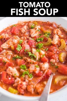 a bowl of tomato fish soup with a spoon in it and the title overlay reads, tomato fish soup