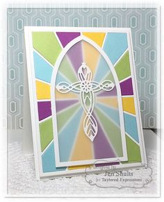 a colorful card with a cross on it