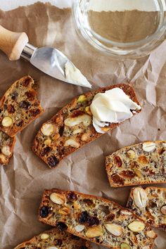 slices of bread with nuts, raisins and butter