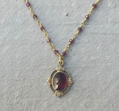 This vintage-inspired necklace is handmade using a 2mm genuine garnet wire-wrapped chain and a 12x17mm pendant with an authentic 6x8mm garnet stone.  This necklace is hypoallergenic. (Cadium free, lead free, and nickel safe) Garnet is an energizing stone that promotes passion and love.  The necklace comes in a hand-wrapped gift box, ready to be gifted. If you would like to leave a note for the recipient, you can do so during checkout. Please note that each stone is unique and varies in color. Handmade Unique Jewelry, Garnet Necklace Vintage, Unique Jewelry Vintage, Vintage Gold Necklace, Vintage Inspired Jewelry, 1 Tattoo, Inspired Necklace, Crystal Necklaces, Vintage Necklaces