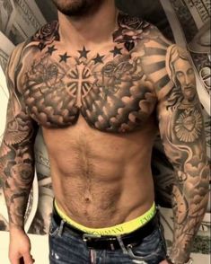 a man with lots of tattoos on his chest