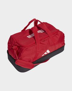 This adidas Tiro League duffel bag is perfect for carrying your football gear to and from the game. The hard-case bottom compartment keeps your essentials safe and organised, and the side mesh pocket is perfect for holding a water bottle or half-time snacks. The large U-shaped opening means no more rooting around for your gear.Made with a series of recycled materials, and at least 40% recycled content, this product represents just one of adidas' solutions to help end plastic waste.• Dimensions: 29 cm x 58 cm x 30 cm• Volume: 40.75 L• 100% polyester (recycled)• Hard-case bottom compartment• Side mesh pocket• Padded, adjustable shoulder strap• Dual carry handles Power Red, Football Gear, Red Adidas, John Galliano, Jd Sports, Adidas Online, Adidas Performance, Sport Bag, Medium Bags