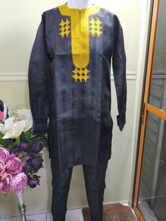 Kaftan for Men, African Native for Men , a 2 pieces Native Attire comprising of A Kaftan Top worn and a Sokoto which is the trouser pant to go with it. The Colour of this is Black with Gold embroidery. It's available for Immediate Shipping in Medium Size. You can however order this in any colours of your choice, just leave me a note when you Order. Ideal for Traditional Weddings, Birthday, and all sort of Celebrations. We would make this item to order within 5-10 working days, and Ship immediate Traditional Black Agbada For Ceremonies, Traditional Black Agbada With Dabka Detailing, Traditional Black Agbada With Dabka, Traditional Black Kaftan For Ceremonies, Ceremonial Long Sleeve Agbada For Festivals, Traditional Fitted Agbada With Long Sleeves, Traditional Fitted Thobe For Festive Occasions, Embroidered Long Sleeve Agbada For Festivals, Fitted Traditional Thobe For Festive Occasions