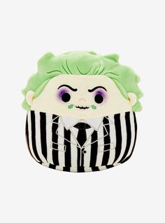 a green and black striped bag with a doll in the middle of it's face