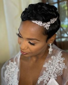 a woman in a wedding dress wearing a tiara