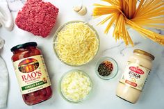 ingredients for pasta laid out on a marble surface