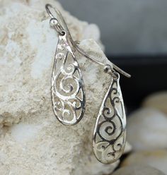 This is the perfect option for those who like cool, unique jewelry and the luxury, shine of silver. The pierced earrings have the shape of drops. The earrings have carved ornament. It is perfect for a gift for birthday, mother's day and holidays. ❤️ The earrings are about 1 2/4'' with loops by 3/8''(in the widest place). ❤️ There is a hallmark: 925. SU.Thailand. ❤️One earring is a little crumpled. Everyone interested in the jewelry should remember that he or she must like their jewelry- not just Silver Hypoallergenic Drop Plug Earrings, Hypoallergenic Silver Drop Earrings, Unique Silver Dangle Teardrop Earrings, Unique Silver Teardrop Dangle Earrings, Silver Plug Earrings As Gift, Sterling Silver Teardrop Earrings For Anniversary, Sterling Silver White Gold Teardrop Earrings Gift, Sterling Silver Pierced Teardrop Earrings For Anniversary, Sterling Silver Teardrop Pierced Earrings For Anniversary