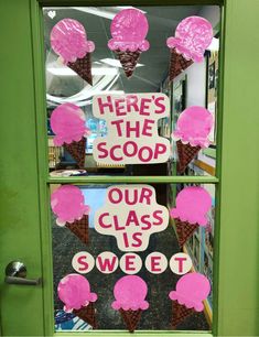 a classroom door decorated with ice cream cones and pink pom - poms that say here's the scoop our class is sweet