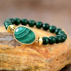 Magic Malachite Stone Bracelet Stretch Immerse yourself in the mystical allure of our Magic Malachite Stone Bracelet a beautiful bracelet in the realm of handmade natural stone jewelry. Adorned with a vibrant malachite charm in an array of green tones, this stretchable bracelet is designed to add a touch of magic to your everyday style. Benefits of Malachite: Beyond its beauty, malachite is believed to bring protection, transformation, and healing energy. Wearing the Magic Malachite Stone Bracel Amethyst Crystal Bracelet, Malachite Bracelet, Bracelet Apple Watch, Rose Quartz Bracelet, Malachite Stone, Couple Jewelry, Yoga Jewelry, Unique Gemstones, Quartz Bracelet