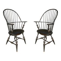 pair of antique windsor style chairs with black leather seat cushions, circa to the mid 20th century