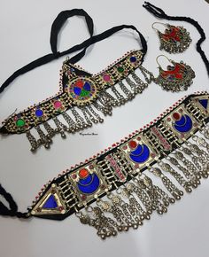 PRODUCT : 1 Vintage Necklace Choker Description This is an Afghan kuchi tribal choker necklace. It's an old handmade Afghan Turkish banjara vintage necklace. You can not go unnoticed at any occasion while wearing it. The back of the necklace has a black cotton cloth for a real comfort. On the top it's decorated with red and white beads. The filigree work is very intricate. The necklace has a black cord on each corner that ties at the back Its a beautiful peace of art created by the tribal people Bohemian Handmade Choker For Rituals, Handmade Bohemian Choker For Rituals, Traditional Handmade Festival Choker, Traditional Handmade Choker For Festival, Traditional Metal Choker For Festivals, Bohemian Metal Choker With Tilla, Bohemian Metal Choker For Ceremonial Use, Bohemian Necklaces With Motifs For Ceremonial Occasions, Bohemian Metal Choker For Ceremonial Occasion