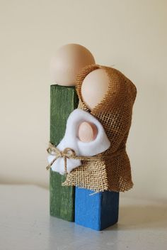 an egg is wrapped in burlock on top of a wooden block