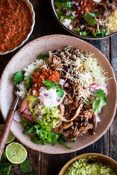 two bowls filled with different types of food and garnished with cilantro