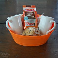 an orange bowl filled with coffee and cookies