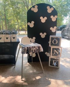 a mickey mouse themed birthday party with black and white decorations, including a table for two