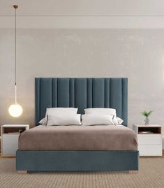 a bedroom with a bed, nightstands and two lamps on either side of the bed