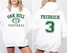 Custom Football Team Name and Number Hoodie, Gift For Football Team Lover,Football Mama Hoodie,Game Day Women Hoodie, Football Mom Hoodie 🌟 Step into the vibrant world of HandmadeColections 🌟 🌟PRODUCT DETAILS🌟 ❤️Our youth hoodies do not have drawstrings for safety reasons.❤️ We use DTF (Direct to Film) printing as our printing technique. Indulge in our meticulously crafted sweatshirts and hoodies, where every detail is carefully considered and double-needle stitching ensures lasting durabili Cheap Team-colored Hoodie For Game Day, White School Spirit Hoodie For Sports, White Hoodie For Sports Events In Fall, Football Season Hoodie With Letter Print For Sports Events, Long Sleeve Hoodie With Letter Print For Football Season, Football Season Hoodie With Letter Print For Game Day, Game Day Hoodie With Letter Print For Football Season, Football Season Sports Fan Long Sleeve Hoodie, White Hoodie For Game Day, Football Season