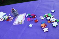 there are many stars on the purple table cloth