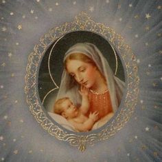 an image of the virgin mary and baby jesus in a frame with stars around it