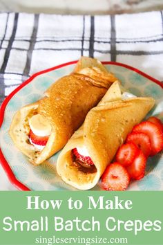 two crepes with strawberries on a plate