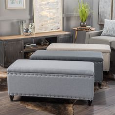 a living room scene with focus on the footstools and the ottoman in the foreground