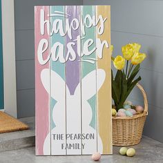 a wooden sign that says, happy easter the reason family is in front of it