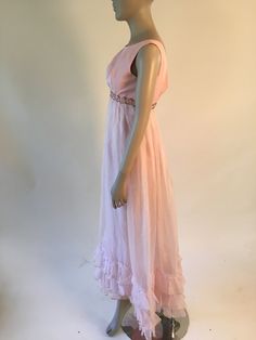 "1960's pink empire waist party dress with sequins at the waist band. Zips up the back (zips all the way but is just a bit small on my mannequin!) Has a sheer overlay over a slip. Overlay has two little discolored spots Size XS Measurements: Bust: 32\" Underbust:27\" Waist: 28.5\" Hip: 36\" Shoulder to bottom of waistband: 11\" Waist to hem: 41\"" Pink Empire Waist Dress For Prom, Pink Empire Waist Prom Dress, Pink Empire Waist Dress, Vintage Empire Waist Party Dress, Fitted Pink Vintage Prom Dress, Vintage Pink Dress For Prom Season, Vintage Pink Dress For Prom, Pink Vintage Dress For Prom Season, Light Pink Party Dress