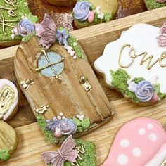 decorated cookies in the shape of fairy houses