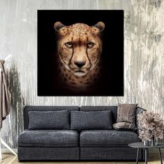 a cheetah's face is shown on the wall in this living room