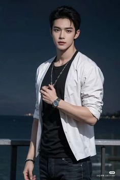 a young man standing on top of a balcony next to the ocean wearing a white jacket and black t - shirt