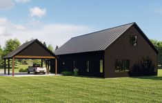 a car is parked in front of a black barn with a carport attached to it