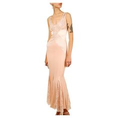 An Incredibly rare floor length gown from Dolce & Gabbana's Fall 2004 collection Pink silk and lace cut out sheer dress with double crystal straps Concealed back zip Size: IT 42. This dress has plenty of stretch so will fit various sizes, please refer to the measurements Composition: Silk 65% Nylon 15% Viscose 15% Polyester 5% Lining- 96% Silk 4% Elastane In pristine condition, they only flaw to note is a small mark on the back at the base of one of the straps. Please refer to the photographs Me Dolce And Gabbana Gown, Valentino Wedding Dress, Minimal Wedding Dress, Valentino Gowns, Silk Sheath Dress, Silk And Lace, Valentino Dress, Backless Wedding, Lace Silk