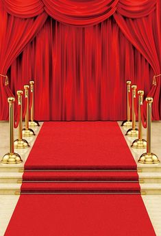 a red carpeted area with gold poles and barriers in front of a red curtain