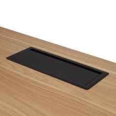 a wooden table with a black tray on it