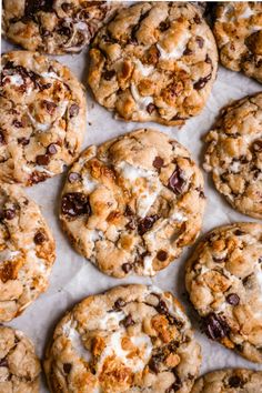 chocolate chip cookies with marshmallows and crumbled on top, lined up in rows