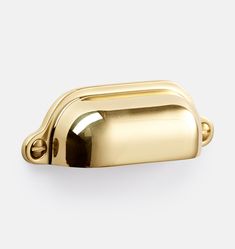 a gold door handle on a white background