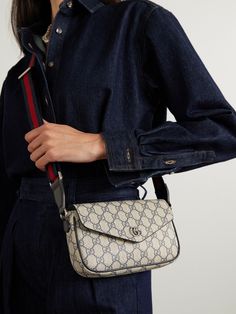 Gucci's 'Ophidia' bag was first introduced in the 2018 'Cruise' collection and has continued to evolve ever since. This version has been made in Italy from the house's iconic 'GG Supreme' coated-canvas with leather trims. It's sized to hold smaller essentials like your phone, wallet, and lipstick. Daily Use Monogram Canvas Flap Bag With Removable Pouch, Designer Coated Canvas Flap Bag With Detachable Strap, Designer Shoulder Bag With Removable Pouch In Coated Canvas, Monogram Canvas Flap Bag With Removable Pouch, Luxury Coated Canvas Flap Bag, Gucci Designer Satchel With Detachable Strap, Gucci Designer Satchel With Adjustable Strap, Gucci Luxury Shoulder Bag With Adjustable Strap, Designer Gucci Satchel With Detachable Strap