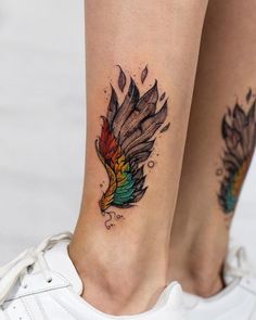 a woman's foot with tattoos on it and an image of a bird in flight