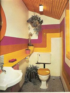 an instagramted photo of a bathroom with orange, pink and yellow stripes on the walls