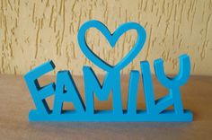 a blue family sign with a heart on it's center and the word family spelled in large letters