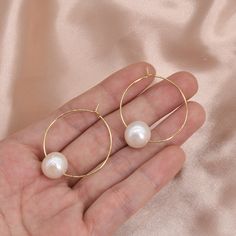 Type:    PEARL LARGE HOOP EARRINGS Feature:  30mm Hoops with Large Round 11-12mm Freshwater Round Pearls Pearl color:Natural white Pearl size:11-12mm  Pearl shape:Round Pearl luster: Very high Pearl blemish: 85% free Material:   14K Gold Plated on Brass Please Note: Due to the variance of the natural pearls, size measurement is approximate, and color may vary a little. Pearl White Hoop Earrings For Wedding, Hypoallergenic Round Pearl Earrings For Party, Nickel-free White Hoop Pearl Earrings, Nickel-free Round Earrings For Wedding, Pearl White Hoop Jewelry Gift, Pearl White Hoop Pearl Earrings As Gift, Pearl White Hoop Earrings For Gift, Pearl White Hoop Jewelry For Gift, Round Pearl Drop Bridal Earrings