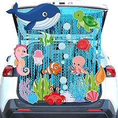 the back end of a car with an ocean scene on it