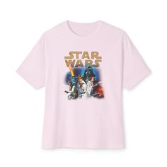 ✨ Elevate your Star Wars style with our custom oversized t-shirt featuring iconic Star Wars characters and the legendary phrase "Star Wars." 💫 Comfort and style collide in this relaxed-fit tee, complete with dropped shoulders for a modern aesthetic that seamlessly blends into any occasion. 🌟 Made with 100% airlume, ring-spun, and combed cotton, this shirt offers exceptional softness and comfort, ensuring a luxurious feel with every wear. 🎨 Whether you're lounging at home or heading out for an adventure in the galaxy far, far away, this t-shirt is the perfect choice for Star Wars enthusiasts. 🛍️ Treat yourself or surprise a fellow Star Wars fan with this must-have addition to any wardrobe – it's sure to become a favorite for casual outings and movie marathons alike! Garment Info:✨Unisex Pop Culture T-shirt With Character Print And Relaxed Fit, Oversized Pop Culture T-shirt With Letter Print, Oversized Pop Culture Graphic T-shirt, Pop Culture T-shirt With Character Print In Relaxed Fit, Pop Culture Relaxed Fit T-shirt With Character Print, Pop Culture T-shirt With Logo Print In Relaxed Fit, Star Wars Style, Boxy Tee, Star Wars Characters